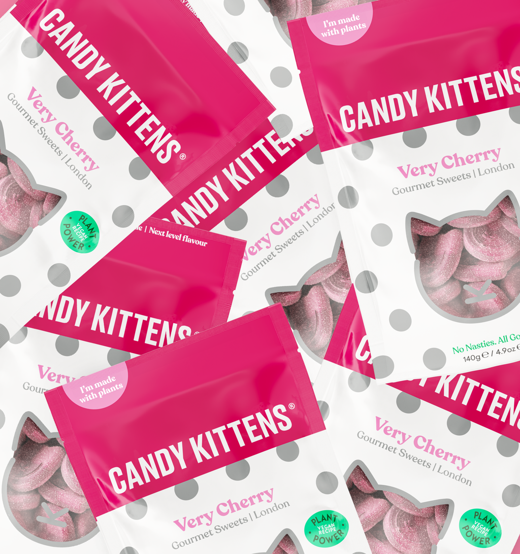 Candy Kittens Very Cherry sweets packaging on a white background with gray polka dots